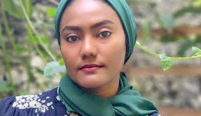 A maldivian woman in a headscarf in rainforest.