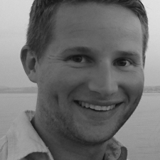 Profile photo of Michael Gerry, Finance Manager at Common Seas. Michael is weather a light-coloured shirt and smiling at the camera. Photo is in greyscale.