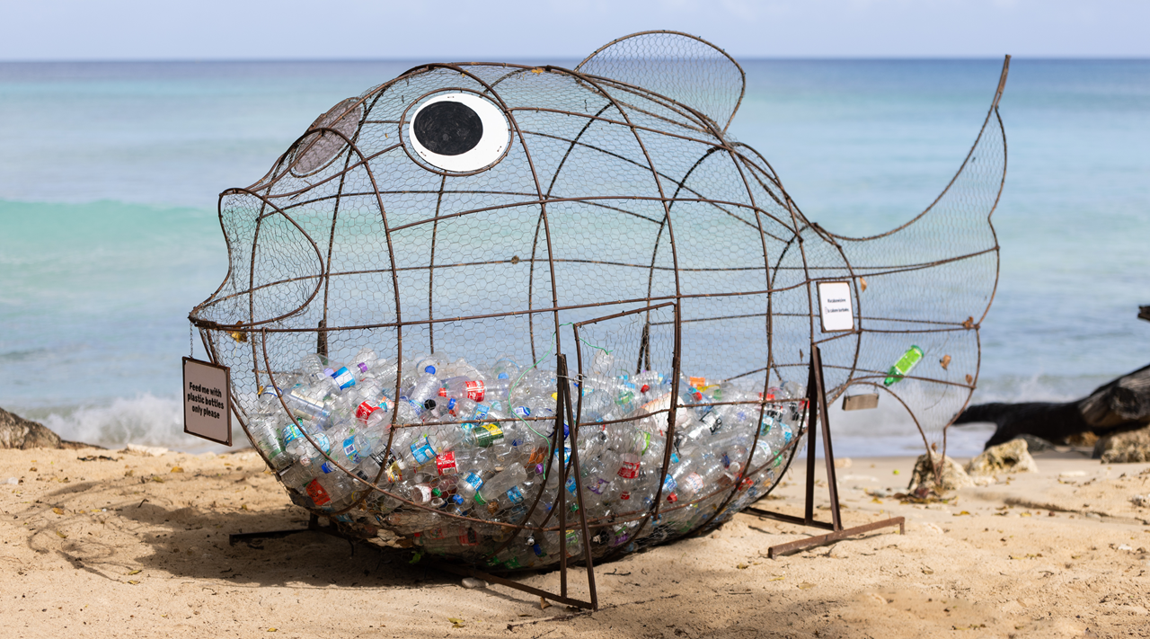 Fish-shaped rubbish cage on a beach in Barbados